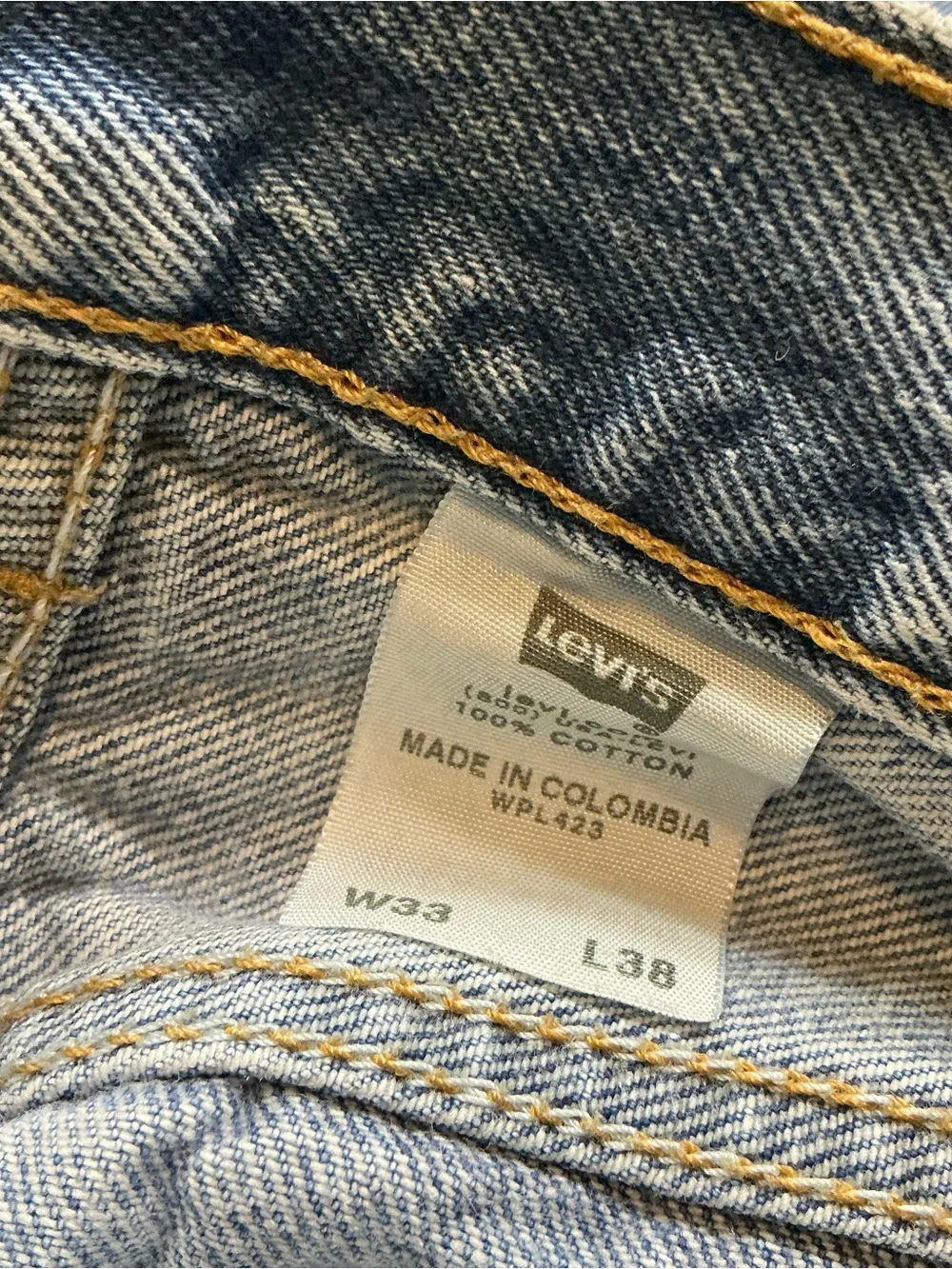 Vintage Levi’s 501XX button fly medium wash straight leg jeans 32 x 32